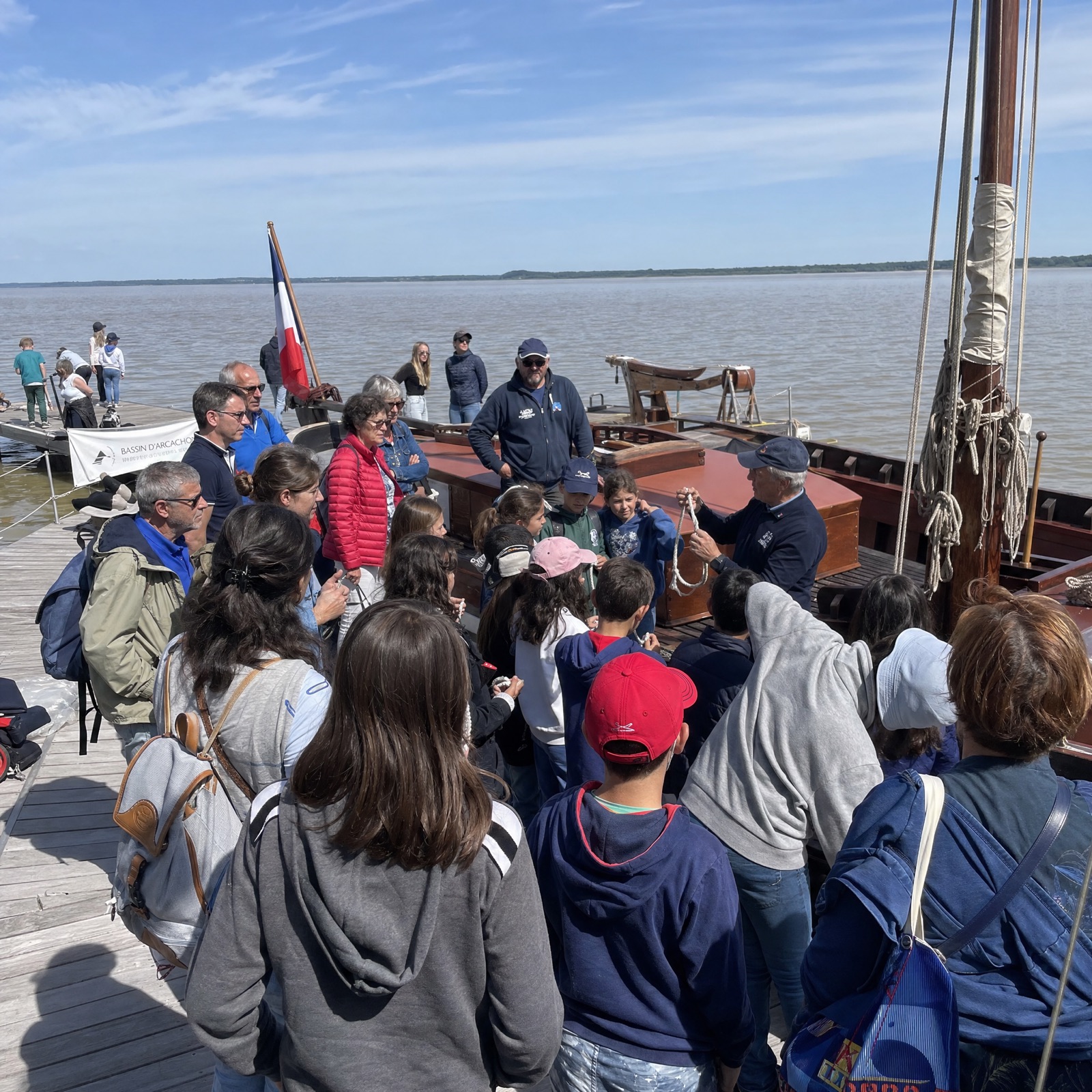 Visitors at the Journée de l'Estuaire, exploring a restored pinasse on the Gironde